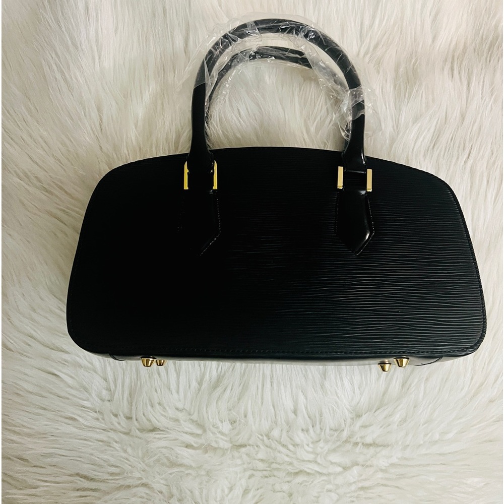 Women’s black and gold handbag with strap